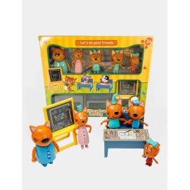 Три кота գրասեղանով